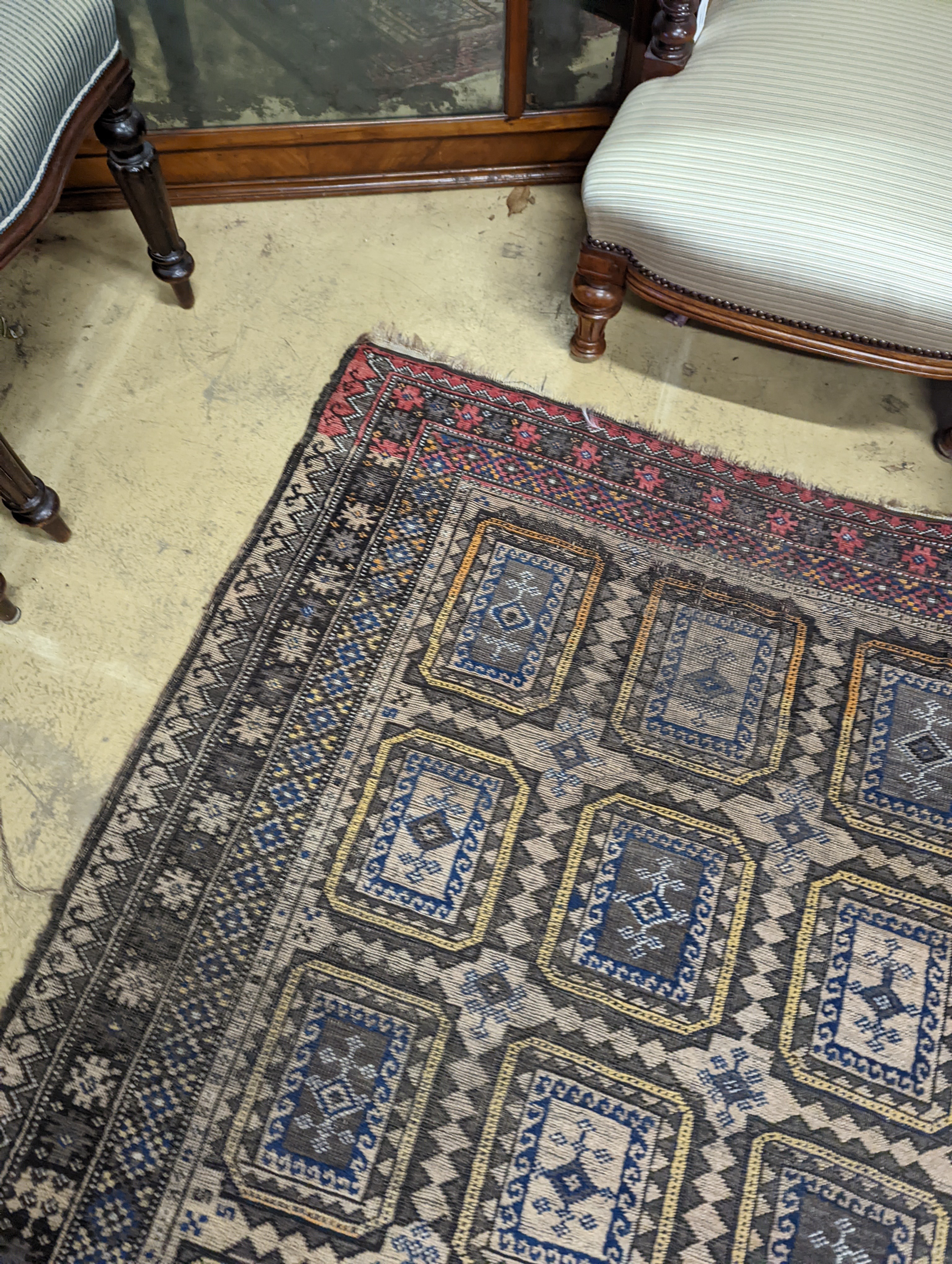 A Belouch geometric rug, 216 x 130cm. together with four Kelim cushion covers